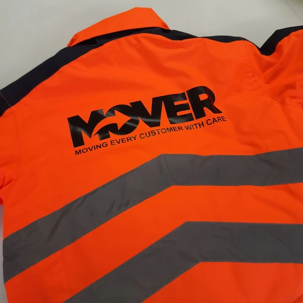Orange Hi-Vis jacket with HTV applied to rear in black
