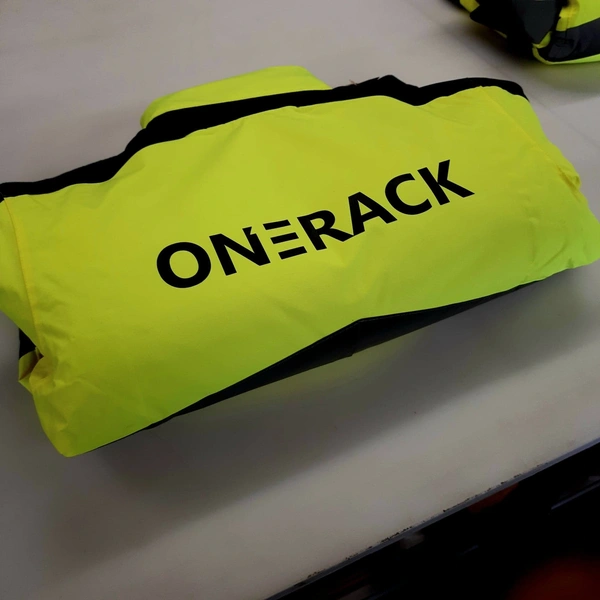 Yellow Hi-Vis jacket with HTV applied to rear in black